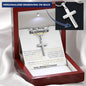 a personalized cross necklace in a mahogany box angled to left