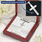 a personalized cross necklace in a mahogany box angled to the right