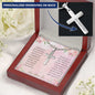 A personalized cross necklace in a mahogany box angled to the left.