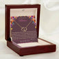 everlasting love necklace in mahogany box angled left