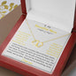A everlasting love necklace in a mahogany box on a table up close.