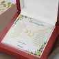 a everlasting love necklace in a mahogany box on a table angled right up close