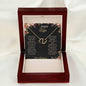 A 10k gold Everlasting Love Necklace in a mahogany box with a to wife greeting card
