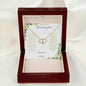 a everlasting love necklace in a mahogany box on a white cloth