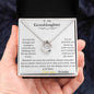 A white gold lucky in love necklace up close in a models hands