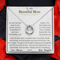 a lucky in love necklace up close with red rose petals