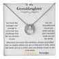 A white gold lucky in love necklace up close