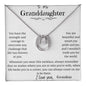 A white gold lucky in love necklace up close