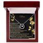 lucky in love necklace in mahogany box up close