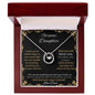 Lucky In Love Necklace with a white gold charm in a mahogany box angle 1