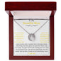 A lucky in love necklace in a mahogany box
