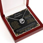 Lucky In Love Necklace with a white gold charm in a mahogany box angle 2