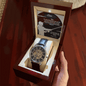 openwork watch in a mahogany box in a model's hand
