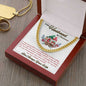 yellow gold Cuban link chain in a luxury box angled to the right