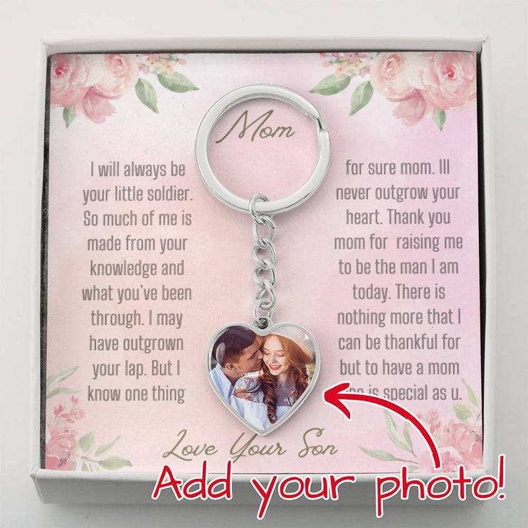 A polished stainless-steel photo upload personalized heart pendant keychain.
