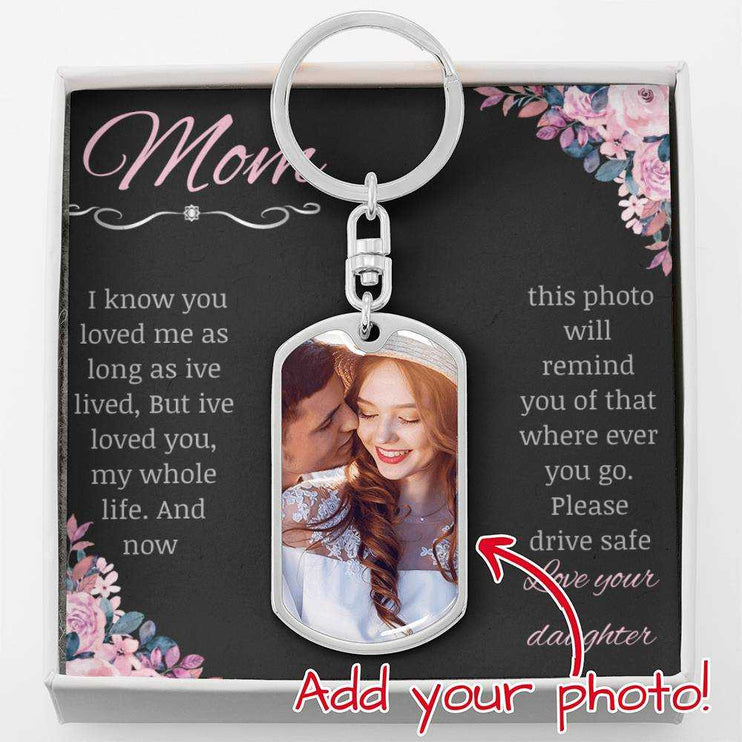  A polished stainless-steel photo upload dog tag swivel keychain in a two-tone box up close