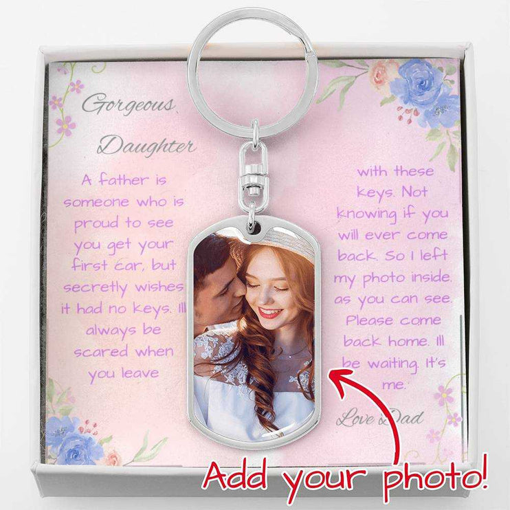 A polished stainless-steel photo upload dog tag swivel keychain in a two-tone box up close