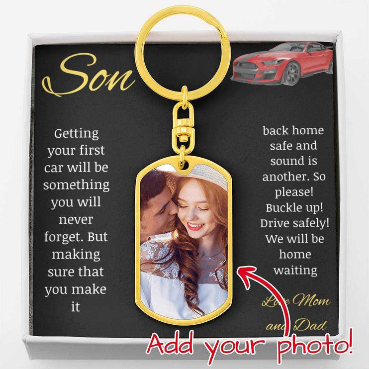 A yellow gold finish photo upload dog tag swivel keychain in a two-tone box up close