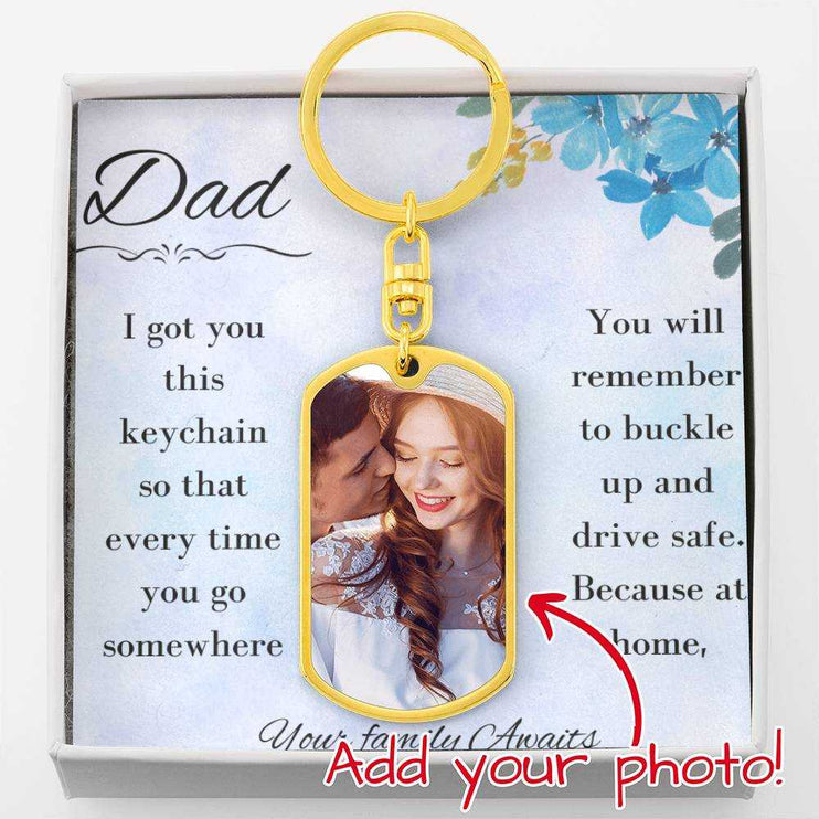 A yellow gold finish photo upload dog tag swivel keychain in a two-tone box up close