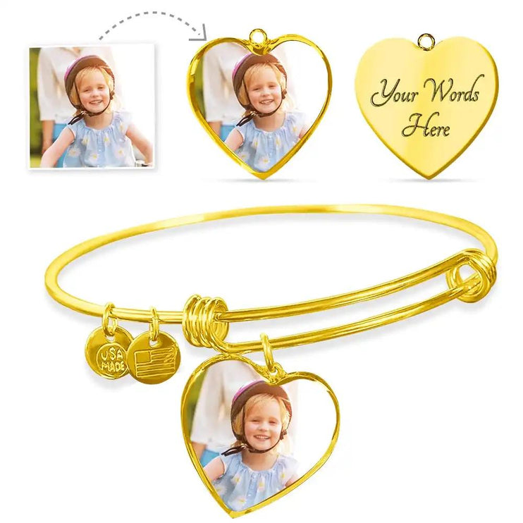 a yellow gold photo upload personalized heart bangles showing engraving feature