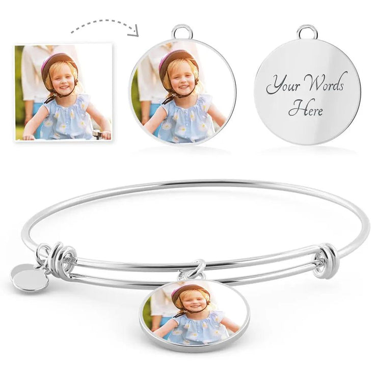 a polished stainless-steel photo circle pendant bangle showing picture option.