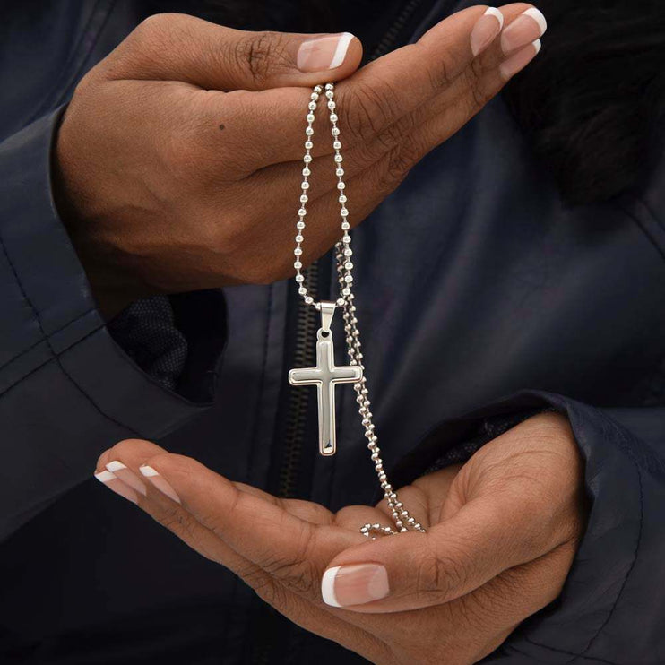 personalized cross on ball chain in model's hands