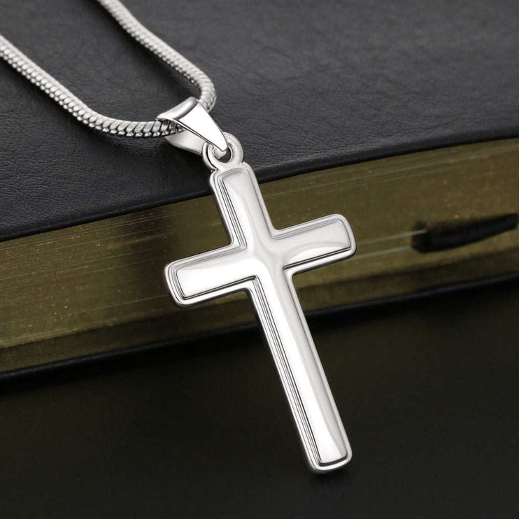 personalized cross on snake chain close up of cross on a bible