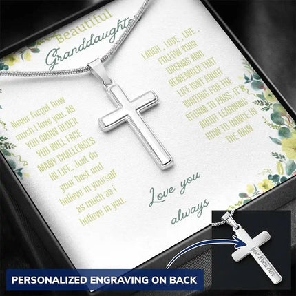 Personalized Cross Necklace with a polished stainless-steel cross and a to granddaughter greeting card in a two-tone box angled slightly right 