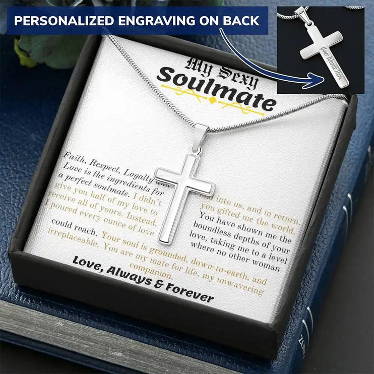 a personalized cross necklace in a two-tone box angled to the right