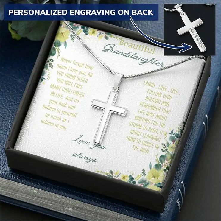 Personalized Cross Necklace with a polished stainless-steel cross and a to granddaughter greeting card in a two-tone box angled slightly left  