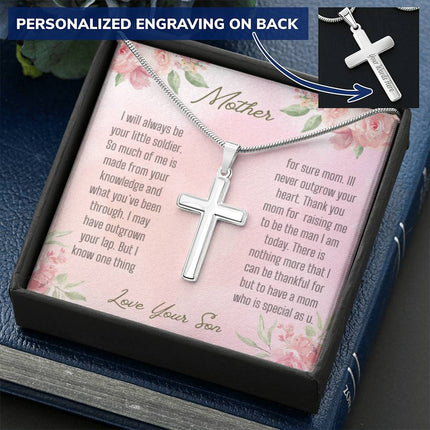 A personalized cross necklace in a two-tone box.