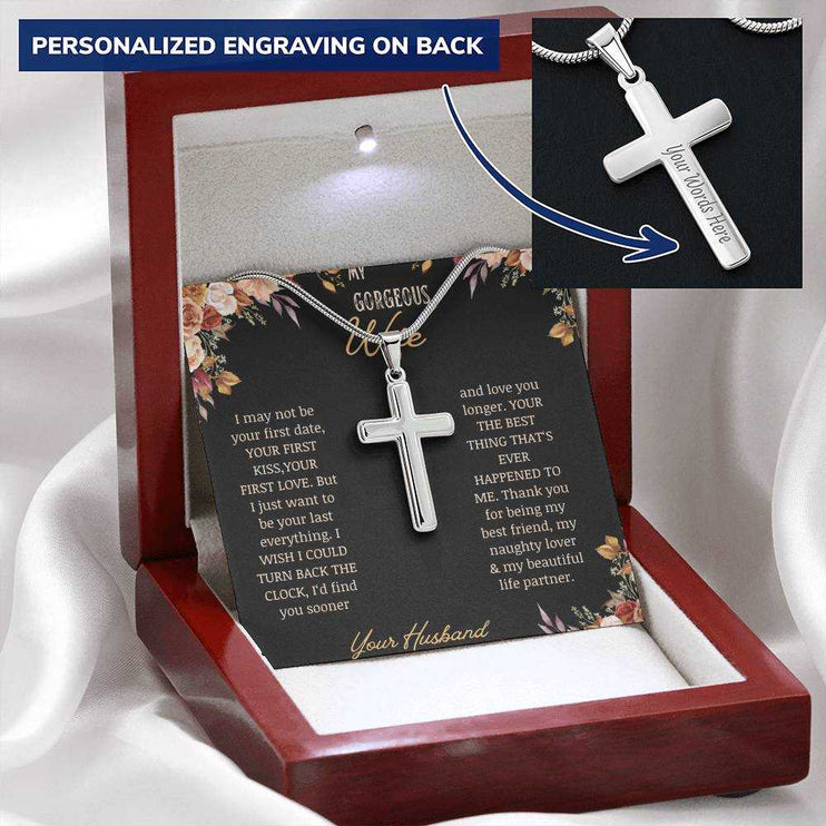 A personalized cross necklace on a to gorgeous wife greeting card in a mahogany box on a white cloth.