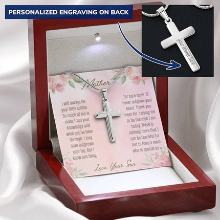 A personalized cross necklace in a mahogany box angled to the left.