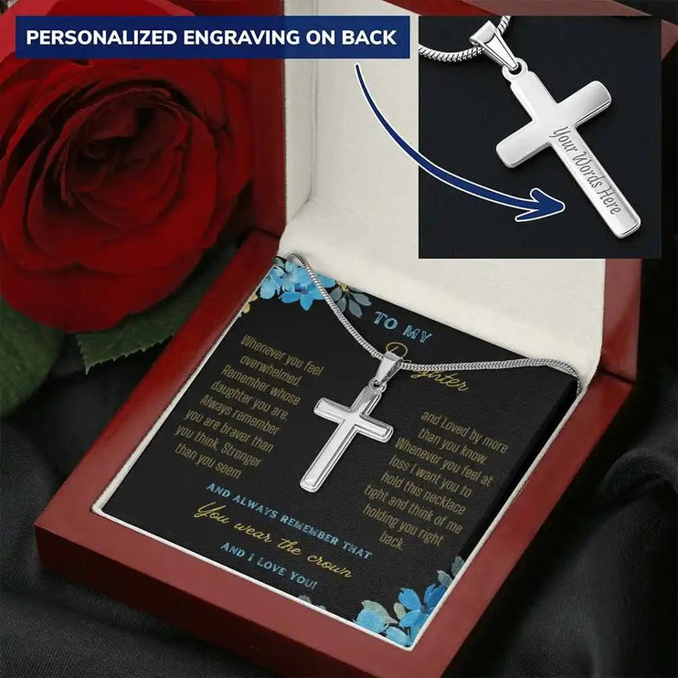 a personalized cross necklace in a mahogany box angled right up close.