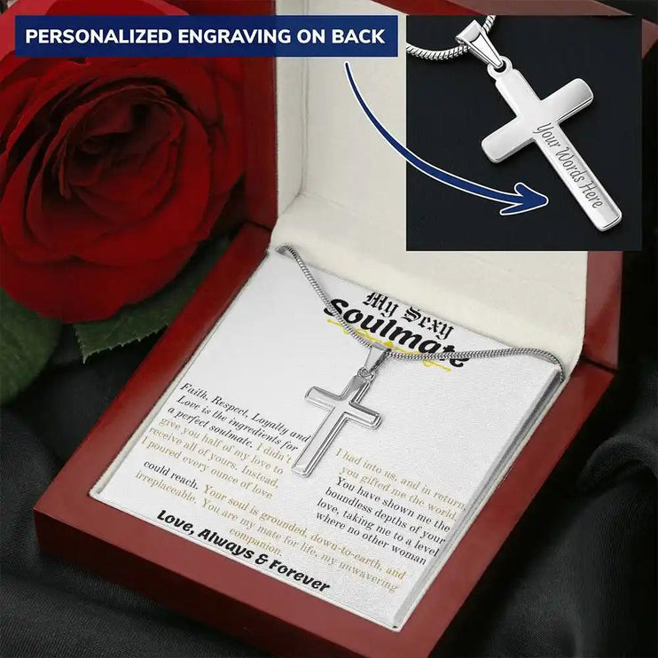 a personalized cross necklace in a mahogany box with a red rose