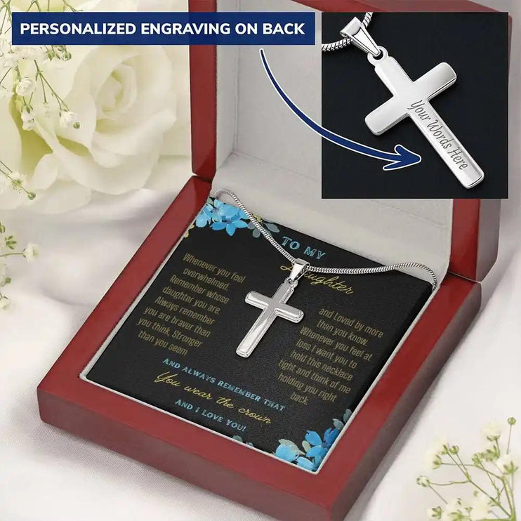 a personalized cross necklace in a mahogany box angled right.