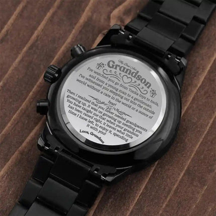a black chronograph watch flipped over