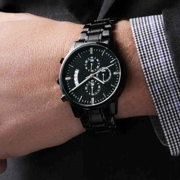 engraved chronograph watch on model's wrist