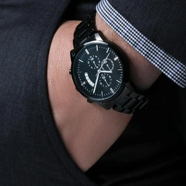 engraved chronograph watch on model's wrist