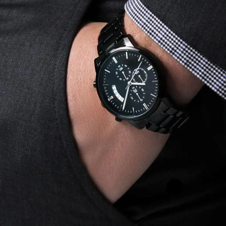 engraved chronograph watch on model's wrist