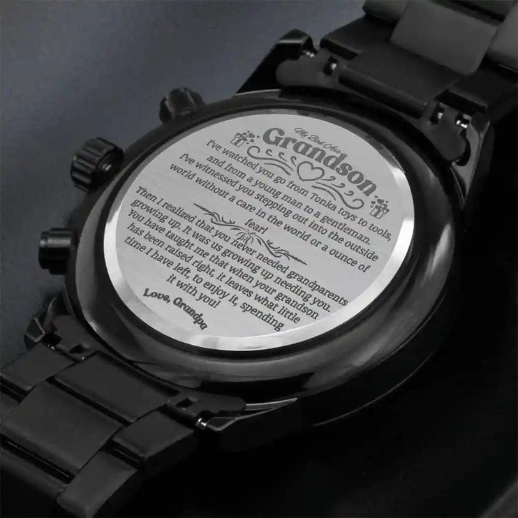 a black chronograph watch showing the message up close.