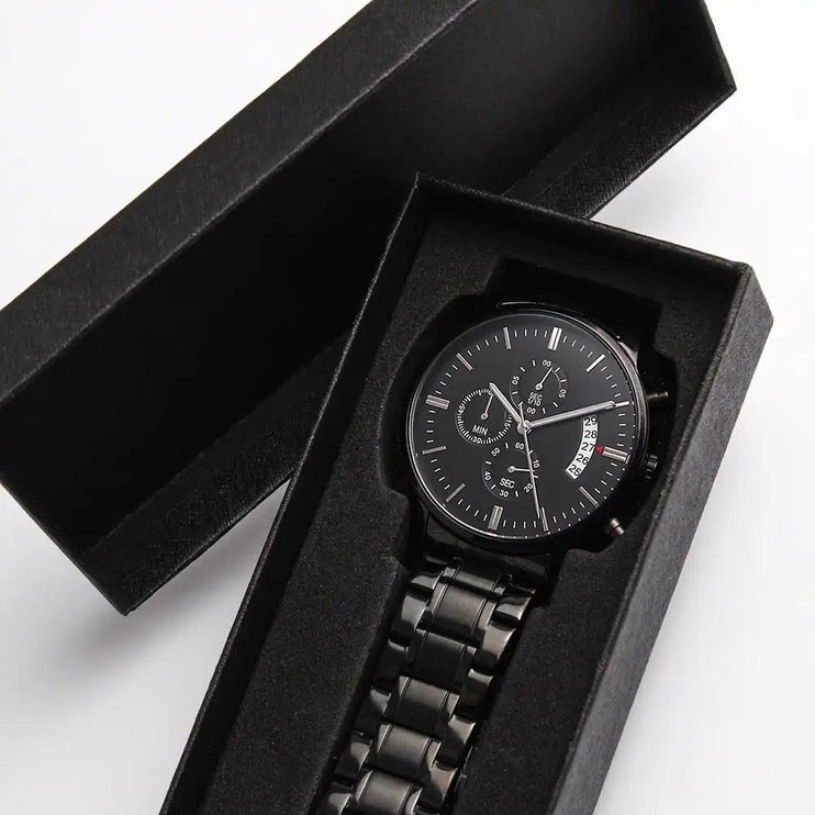 Engraved Chronograph Watch laying in a two-tone box.