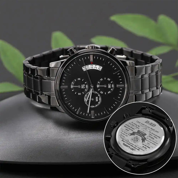 Engraved Chronograph Watch laying on a grey rock