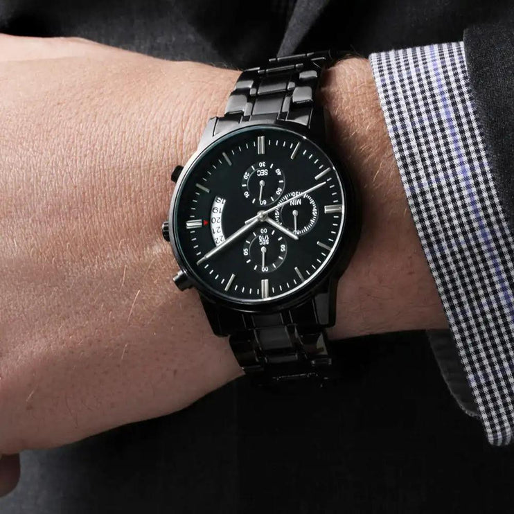 black chronograph watch on model's wrist