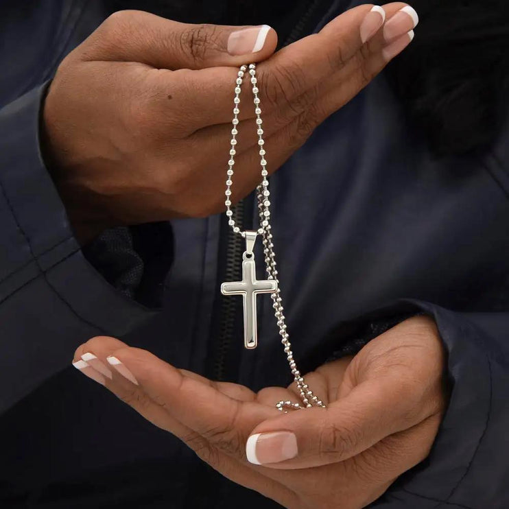 cross on ball chain cross on ball chain necklace in model's hands