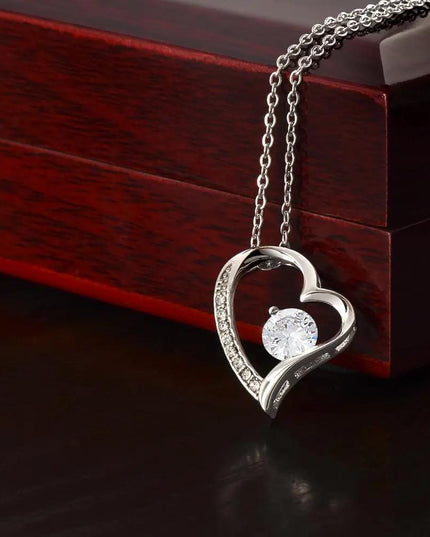white gold forever love necklace on top of two-tone box