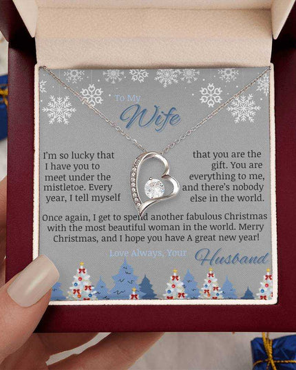 white gold forever love necklace in luxury box in model's hand