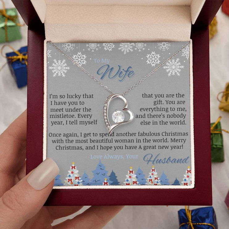 white gold forever love necklace in luxury box in model's hand