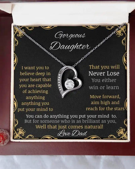 Forever Love Necklace with a white gold charm in a mahogany box with a to daughter from dad greeting card angle close up on a table 