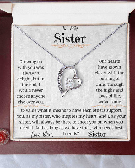 a white gold forever love necklace in a mahogany box